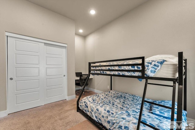 bedroom with a closet and carpet