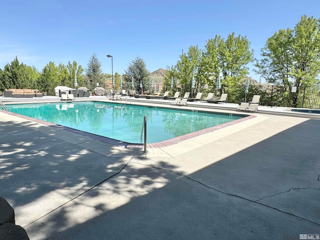 view of swimming pool featuring a patio area