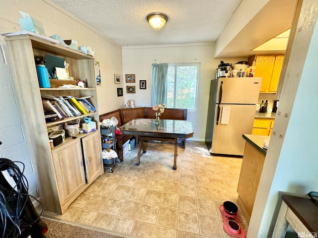 tiled home office featuring a textured ceiling