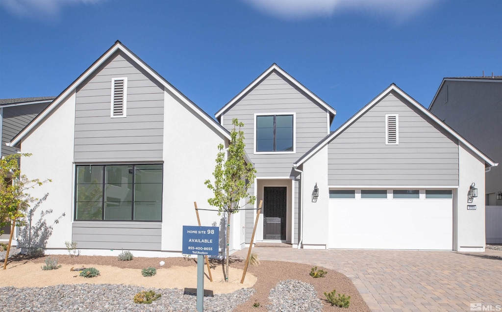 view of front of property with a garage