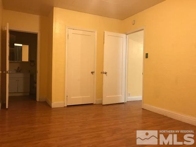 spare room with hardwood / wood-style floors