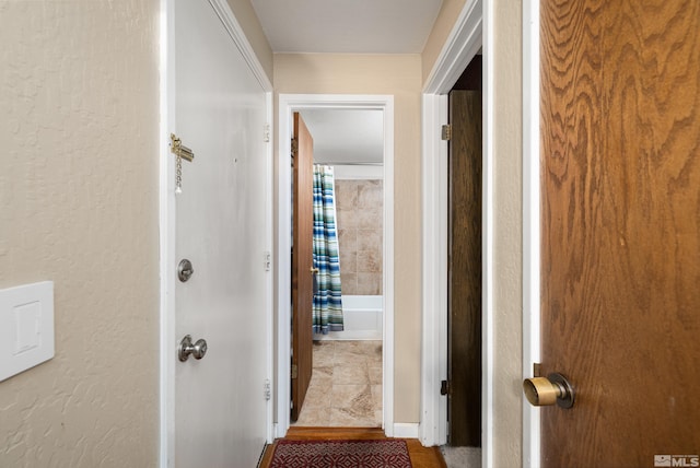 corridor with tile flooring