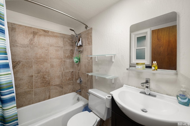 full bathroom featuring a textured ceiling, vanity, toilet, and shower / bath combination with curtain