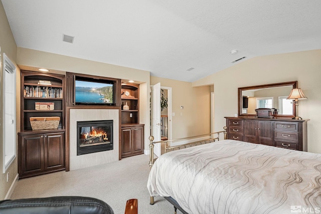 carpeted bedroom with vaulted ceiling