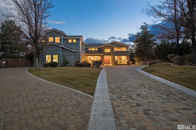 view of property featuring a yard