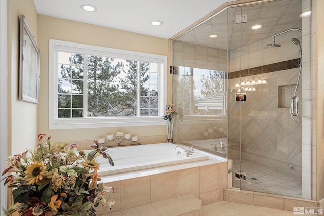 bathroom featuring plus walk in shower and tile flooring