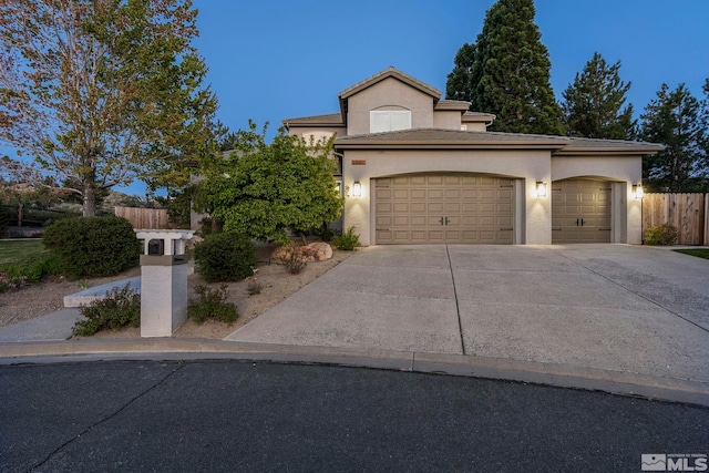 view of front of property with a garage