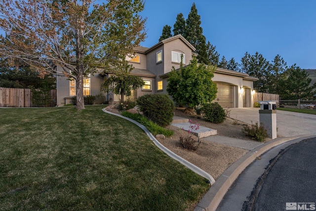 view of front of home featuring a front lawn and a garage