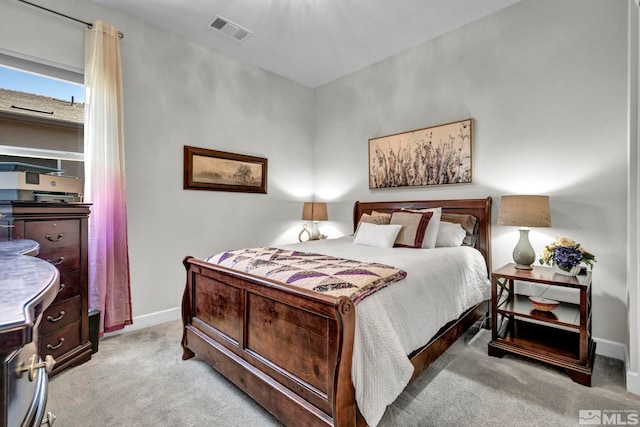 bedroom featuring light colored carpet