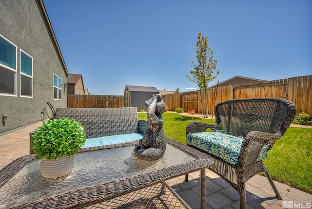 view of patio with a storage shed