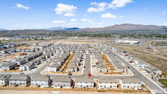 birds eye view of property featuring a mountain view