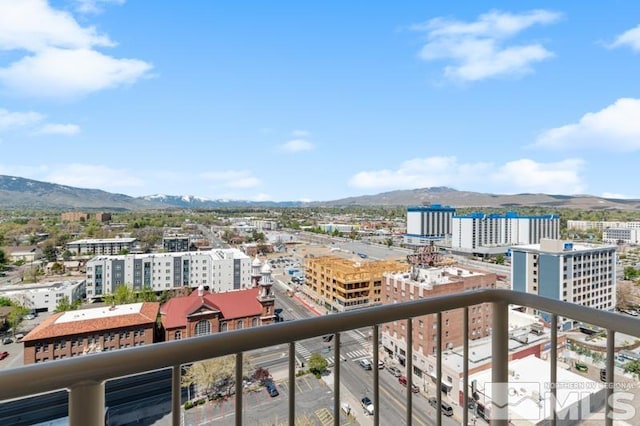 balcony featuring a mountain view