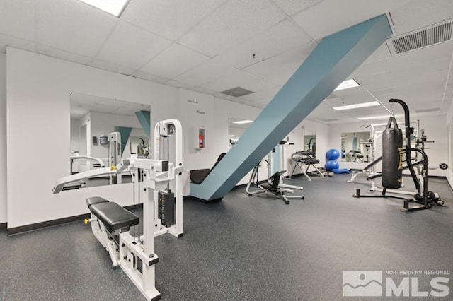 gym featuring a drop ceiling