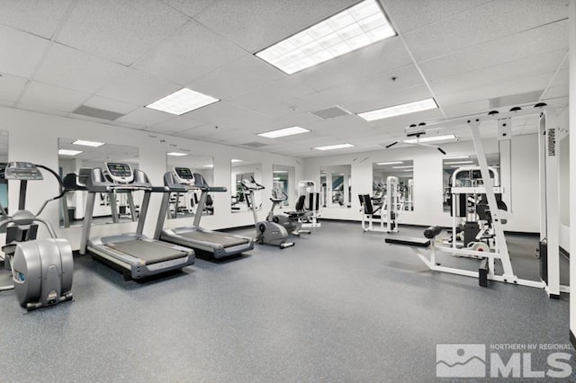 exercise room featuring a paneled ceiling