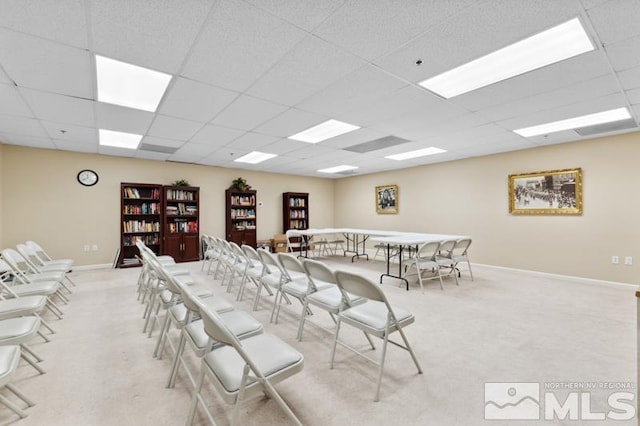 interior space with light carpet and a drop ceiling