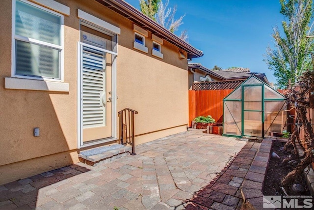 view of patio / terrace featuring a shed