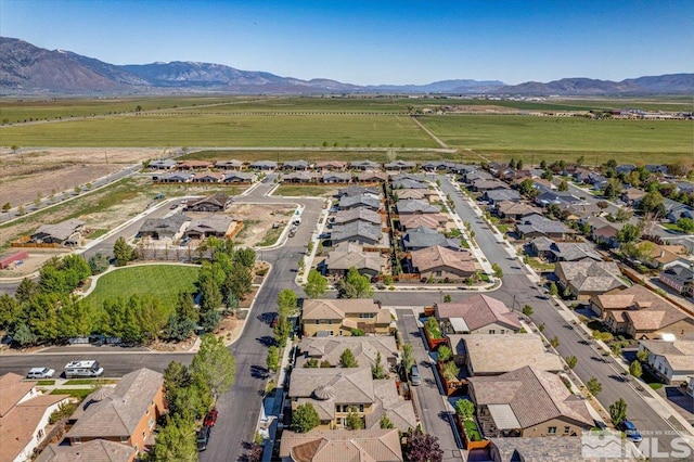 birds eye view of property with a mountain view