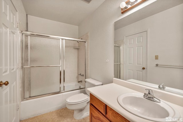 full bathroom featuring vanity, toilet, and bath / shower combo with glass door