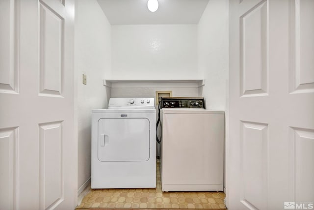 laundry area featuring washing machine and clothes dryer