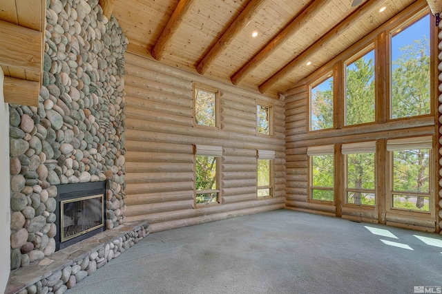 unfurnished living room featuring high vaulted ceiling, log walls, carpet flooring, and wood ceiling