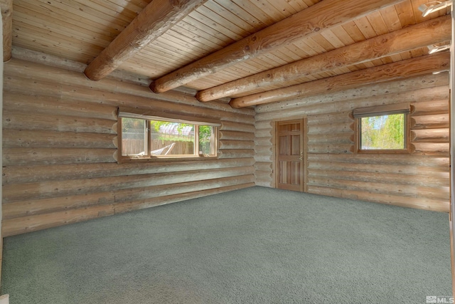 carpeted empty room featuring beam ceiling, log walls, and wooden ceiling