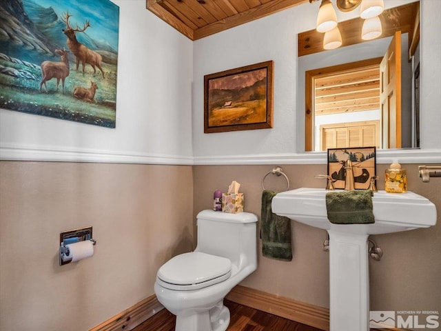 bathroom featuring hardwood / wood-style floors, toilet, and wood ceiling