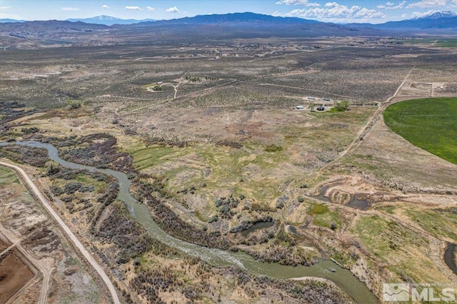 drone / aerial view featuring a mountain view