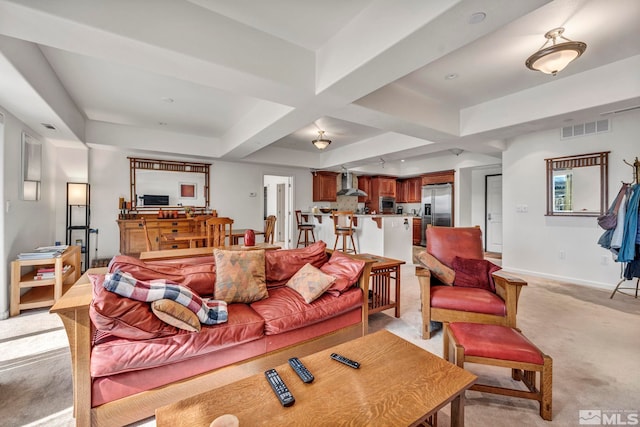 carpeted living room featuring coffered ceiling and beam ceiling