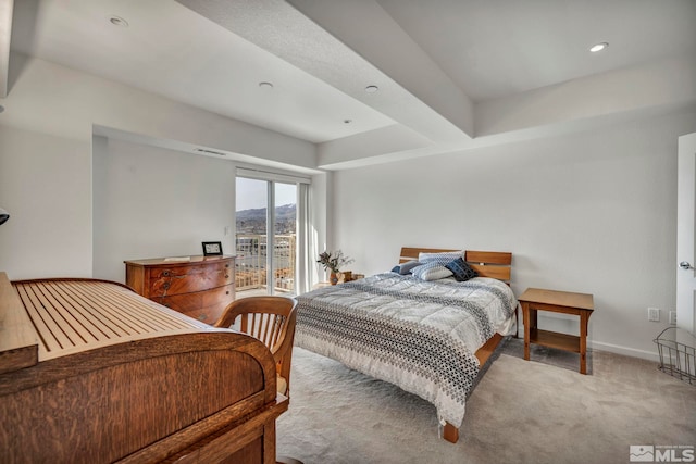 carpeted bedroom featuring access to outside