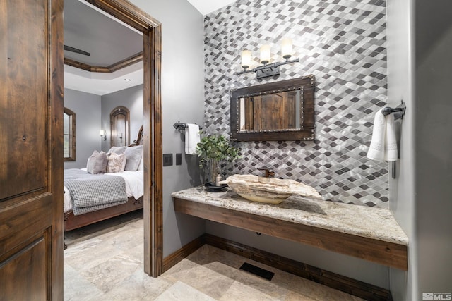 bathroom featuring tile floors and vanity