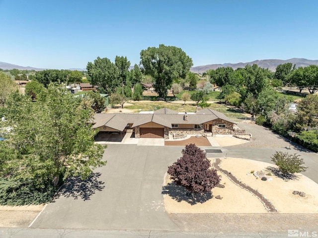 drone / aerial view featuring a mountain view