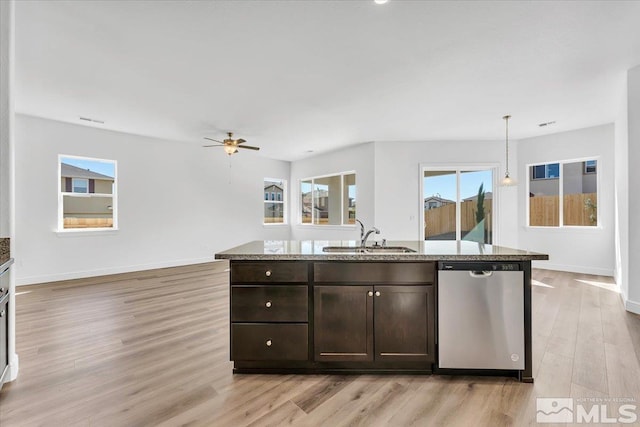 kitchen with pendant lighting, sink, dark brown cabinets, dishwasher, and light wood-type flooring