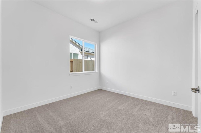 unfurnished room with carpet floors