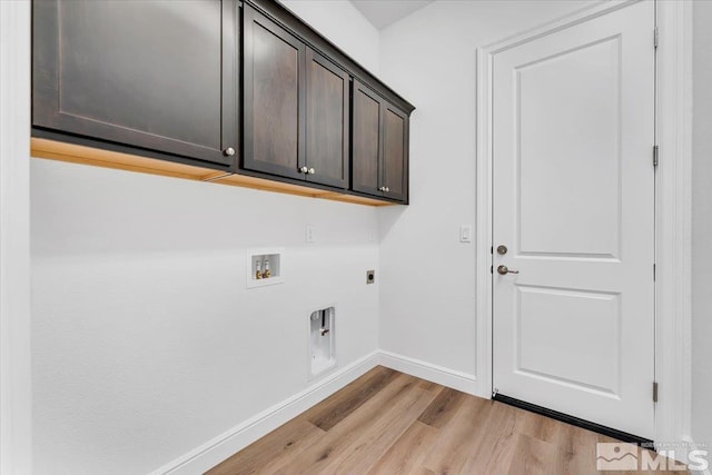 clothes washing area with washer hookup, cabinets, light hardwood / wood-style flooring, and electric dryer hookup