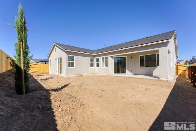 rear view of property featuring a patio