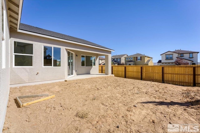 back of house featuring a patio area