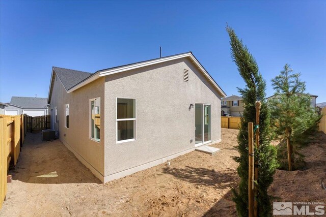 view of side of property with cooling unit