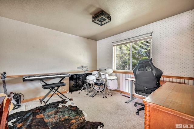 carpeted home office with a textured ceiling