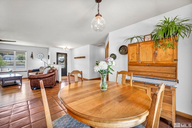 dining space with hardwood / wood-style floors