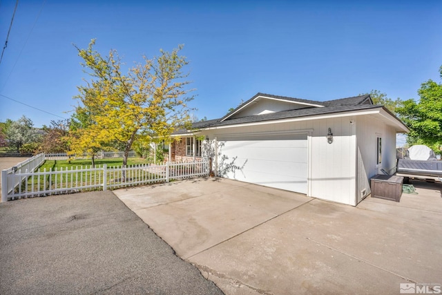 ranch-style house featuring a garage