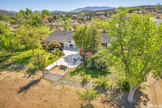 birds eye view of property featuring a mountain view