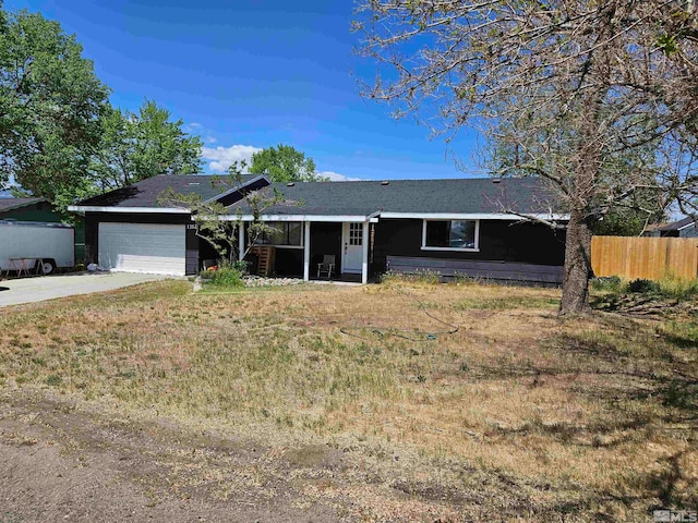 single story home with a front lawn and a garage