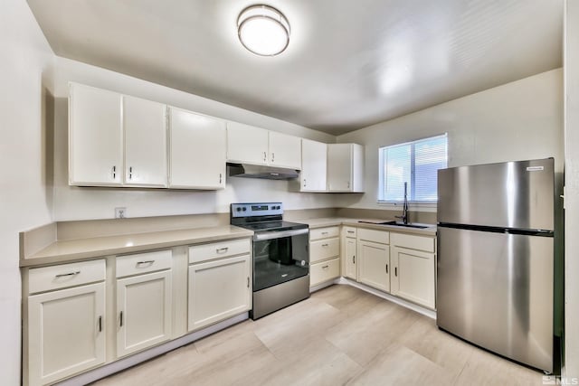 kitchen with white cabinetry, sink, and stainless steel appliances