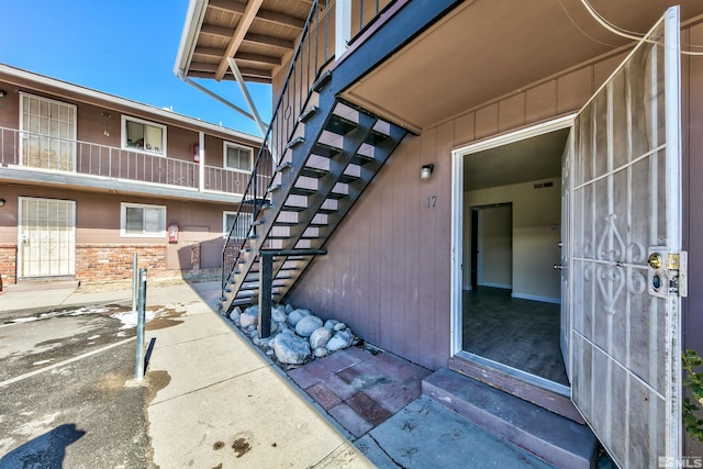 doorway to property with a patio area