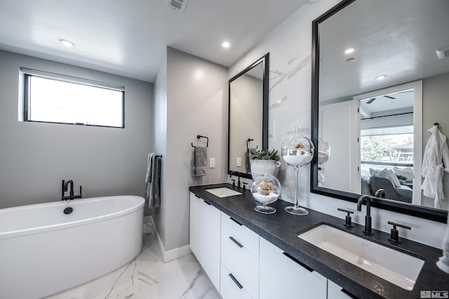 bathroom featuring double vanity and tile floors