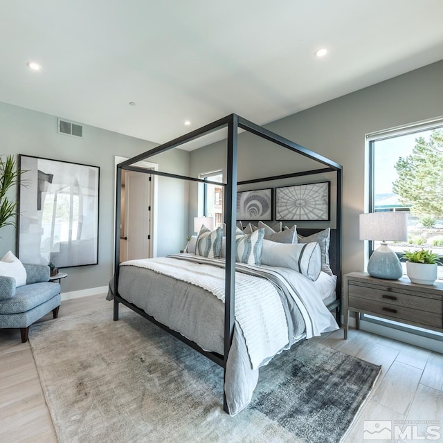 bedroom with light hardwood / wood-style floors