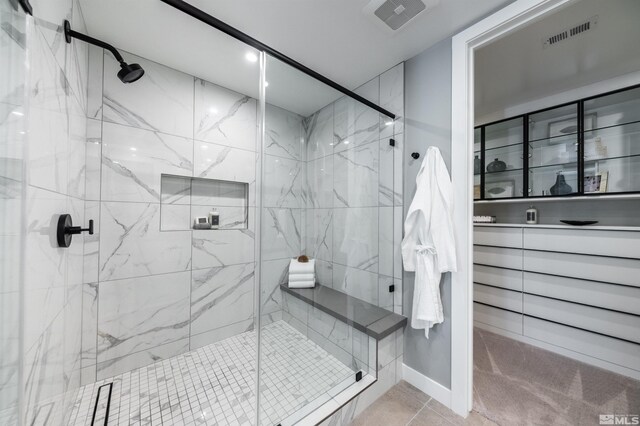 bathroom featuring tile flooring and walk in shower