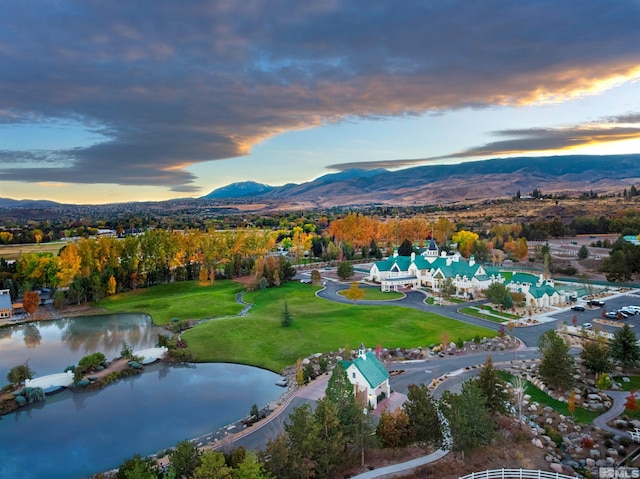 aerial view at dusk with a water and mountain view