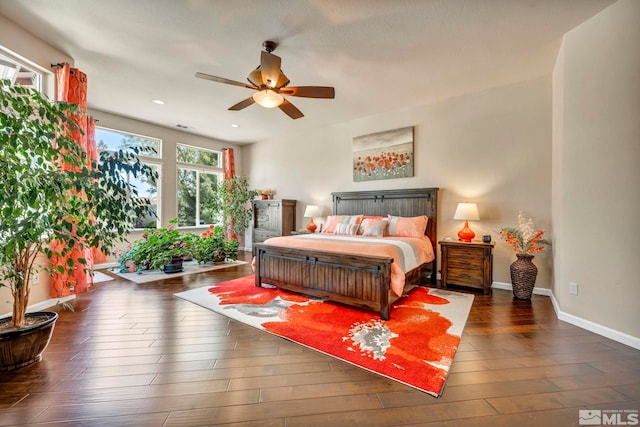 bedroom featuring dark hardwood / wood-style flooring and ceiling fan