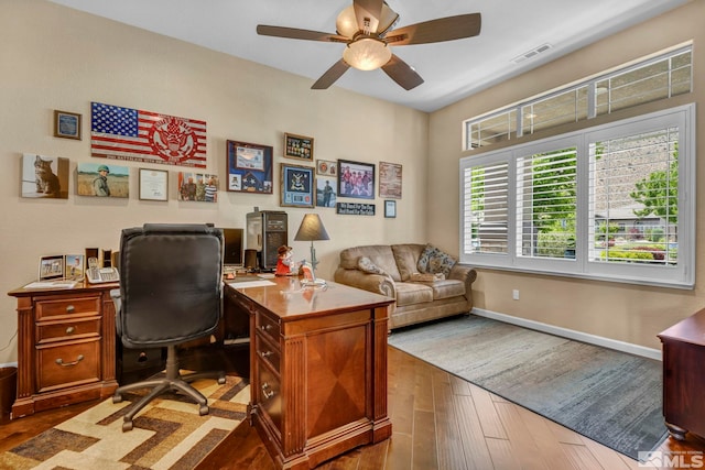 office space featuring ceiling fan and dark hardwood / wood-style floors